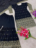 Black and gold embroidered outfit, featuring a matching dress and dupatta set. Comprises of a black long-sleeved dress with an embellished neckline and a matching dupatta, adorned with gold thread work