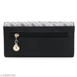 Black embossed leather zip clutch purse with coin charm, multiple slots for cards and coins