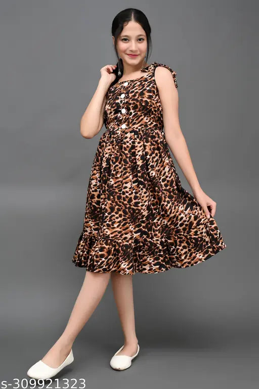 Girls' dress in brown tigerprint with flared skirt and fitted top, for girls aged 8-13 years. Girls' summer wear, frock style