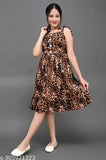 Girls' dress in brown tigerprint with flared skirt and fitted top, for girls aged 8-13 years. Girls' summer wear, frock style
