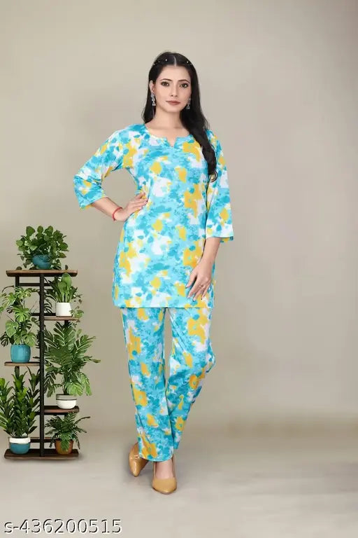 Silk blend women's night suit set with drawstring closure, three-quarter sleeves, and pajama bottom style in a relaxed fit. Made in India