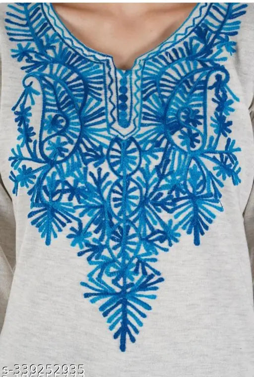 A blue and white patterned, handcrafted, embroidered winter kameez with a neckline detail