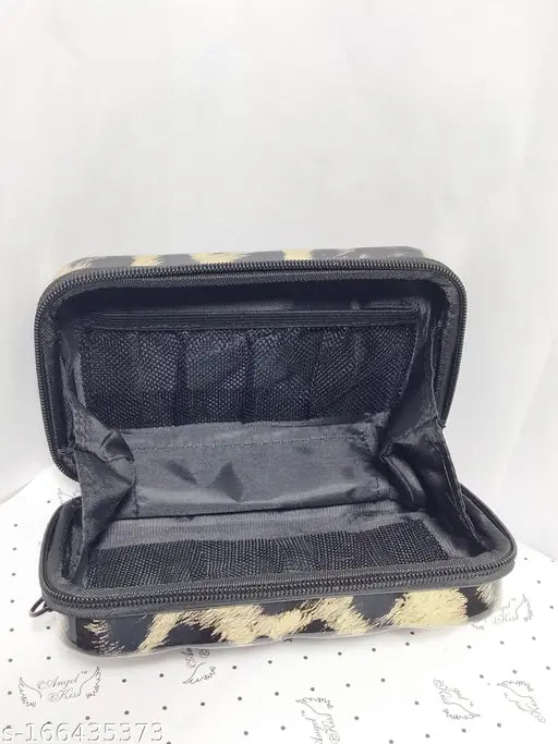Black zebra stripe fabric organizer sling with multiple pockets and a zip closure