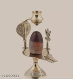 Religious brass decoration showcasing a symbol of Shiva, Haridwar divine Narmdeshwar ling with trident, in a base with three compartments