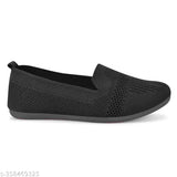 Black synthetic slip-on bellies for women - black comfortable lightweight ballet flats on display