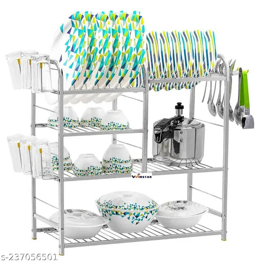 Stainless steel kitchen rack with four shelves, holding dishware and cooking utensils