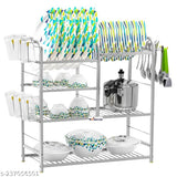 Stainless steel kitchen rack with four shelves, holding dishware and cooking utensils