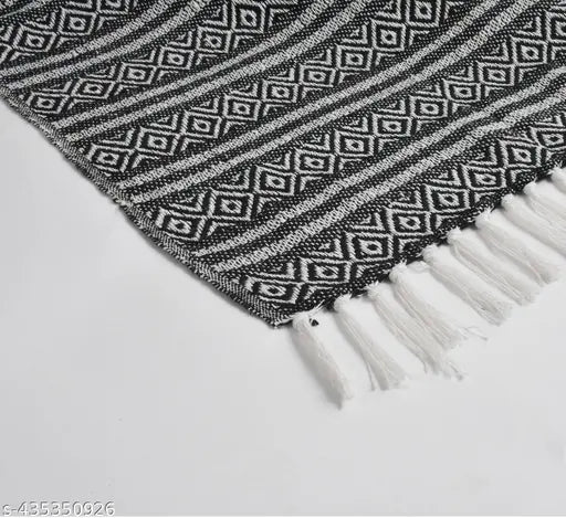 Black and White geometric pattern HomewayTex 100% cotton throw, versatile for indoor/outdoor use as bedspread, sofa cover, blanket or baby blanket. Luxurious, breathable, lightweight, reversible, easy to maintain. Machine washable in cold water or hand wash. Origin: India