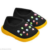 Black children's sneakers with colorful soles and laces