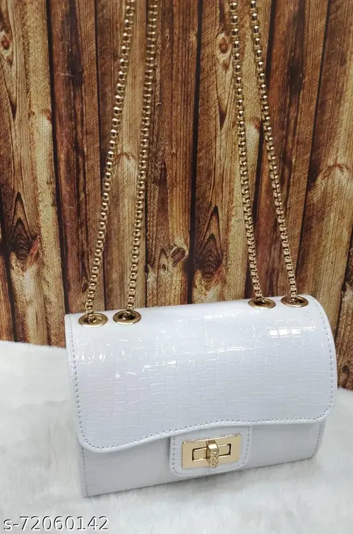 White leather shoulder bag with gold accents