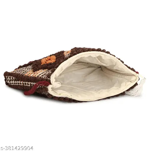 Multi-colored sling bag with a brown trim and interior pockets
