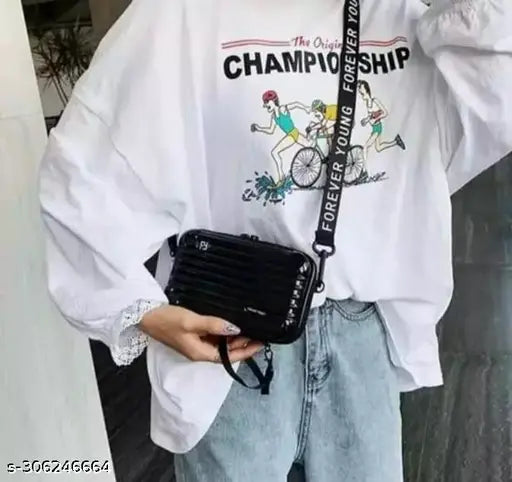 Black sling bag with adjustable strap, for women, featuring a graphic print of the word "Champion