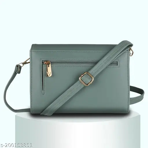 Green faux leather sling bag, 4 compartments, card slots, adjustable strap. Modern, versatile accessory perfect for work or casual wear. Indian-made