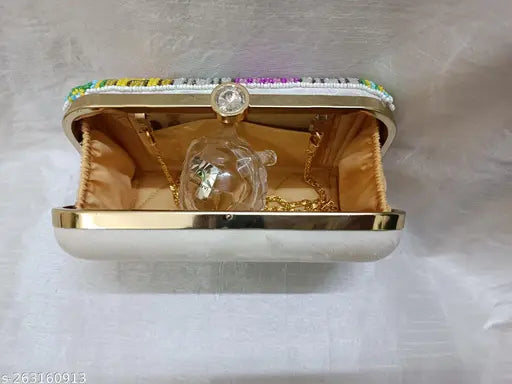 Fashionable ladies exclusive diamond-encrusted clutch purse with gold accents