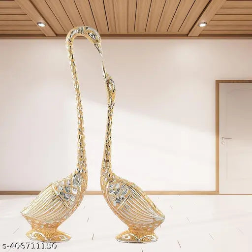 Metal swan pair set for home, temple, or office decoration, Feng Shui showpiece with dimensions: 5 cm (L) x 18 cm (H) x 4 cm (B). Handcrafted in India