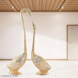 Metal swan pair set for home, temple, or office decoration, Feng Shui showpiece with dimensions: 5 cm (L) x 18 cm (H) x 4 cm (B). Handcrafted in India