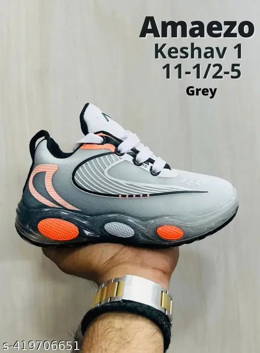Grey and orange men's running shoe with spiked sole