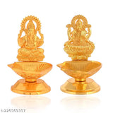 Golden finish Karauli Collection metal Ganesh Laxmi idol diya oil lamp, 5cm x 8cm x 7cm, handcrafted in India. Perfect for home or office puja decor