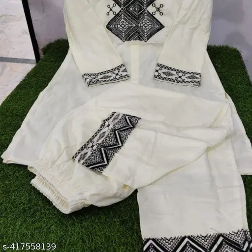 Lemon yellow saree with matching pajama pants, traditional design