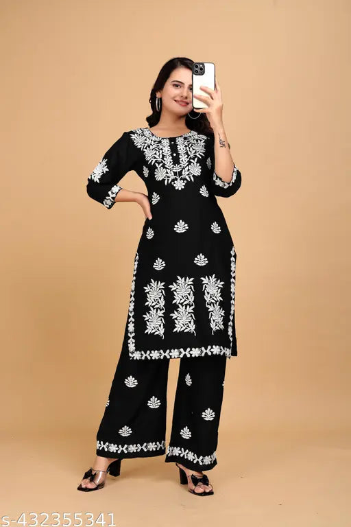 Black rayon kurta set with embroidered net bottomwear, three-quarter sleeves. Indian traditional clothing for women in sizes M to XXXL