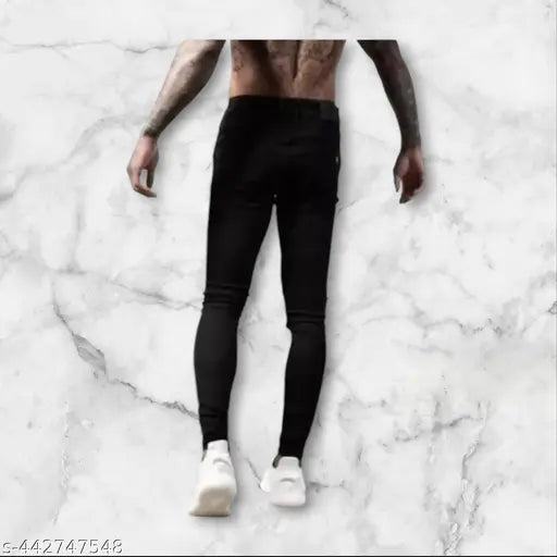 Black jeans with printed design, featuring a full-length silhouette of a person