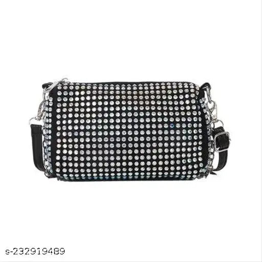 Black crossbody bag with multiple studs and a large rectangular studded pattern on front