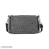 Black crossbody bag with multiple studs and a large rectangular studded pattern on front