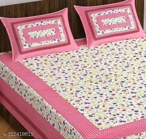 Pink cotton double bedsheet with floral print and pillow cover.