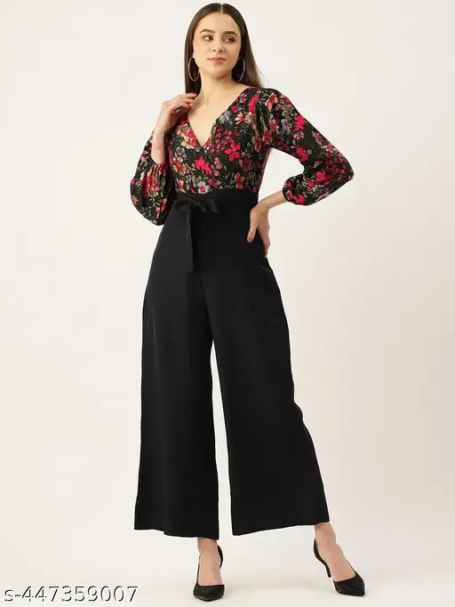 Floral printed polyester VNeck jumpsuit with three-quarter sleeves, black and red floral design, waist tie-ups on a model (size S)