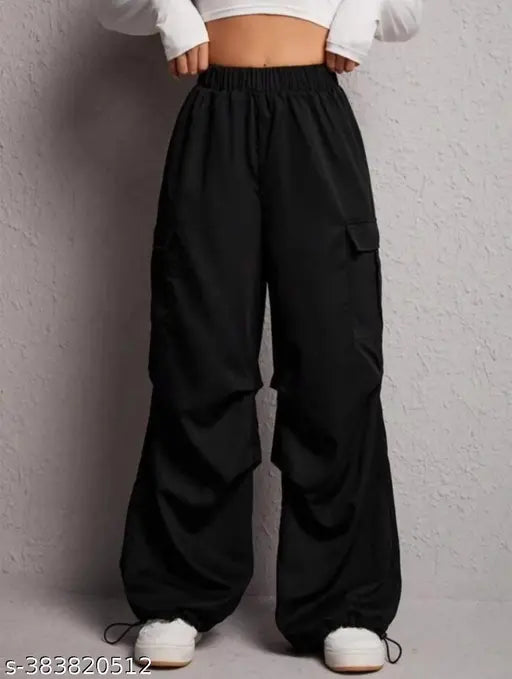 Black pants with drawstring waist, loose fit, side pockets, elasticated waistband
