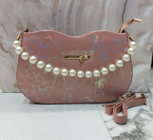 Pink sling bag with pearl trim and multiple pockets