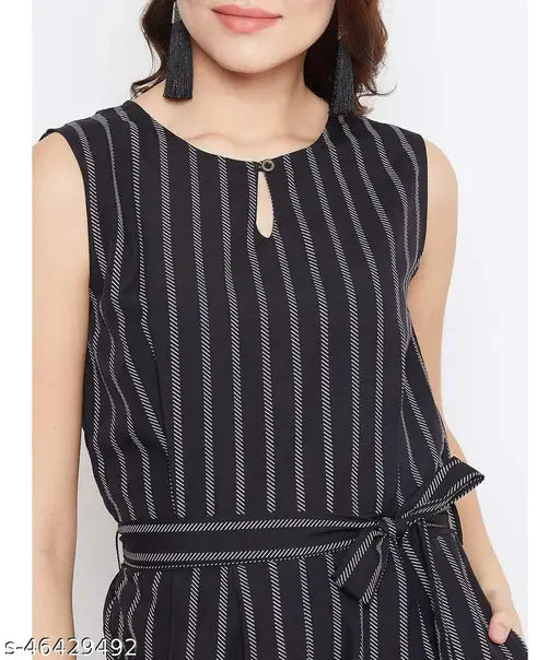 Black printed crepe sleeveless waist-tie jumpsuit, boat neck style on model