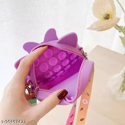 Peach and pink silicone purse with bubble popping feature for sensory stimulation