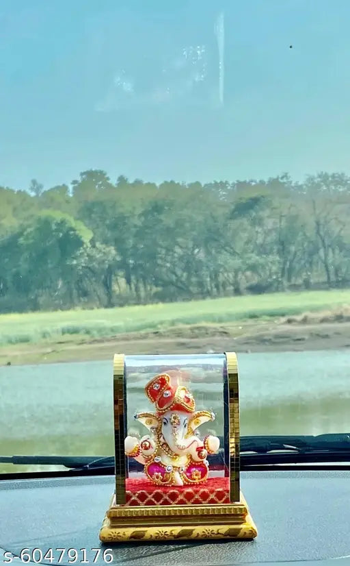 Multi-colored polyresin Lord Ganesha idol for home decor, ideal for living room, car dashboard, or gift. Handcrafted resin showpiece with religious symbolism