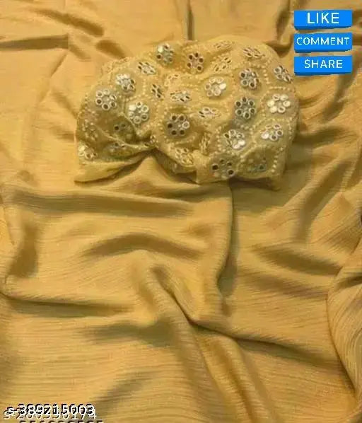 Gold georgette saree with embroidered mirror work blouse