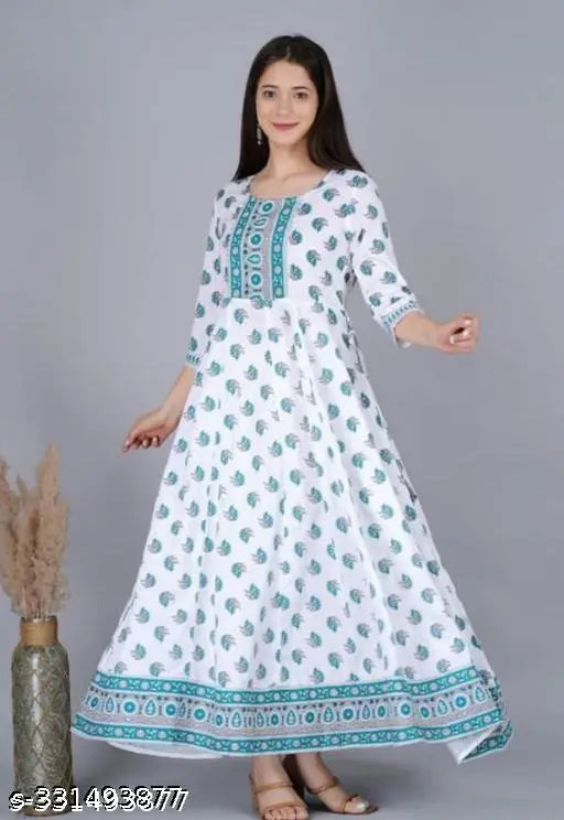 Green Rayon Kurti with White, three-quarter sleeves, printed combo design. M (38 in bust), L (40 in bust), XL (42 in bust), XXL (44 in bust), XXXL (46 in bust), 4XL (48 in bust). Indian traditional wear on mannequin