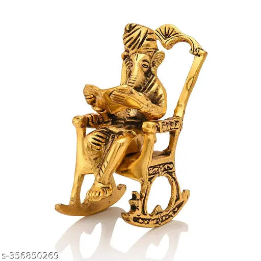Antique golden brass Ganesha statue, seated on a chair reading book, Indian Ganpati idol