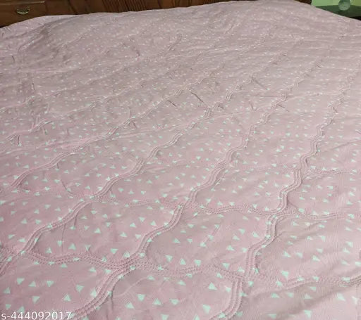 Purple and light blue quilt with stitched pattern, reversible design, suitable for cooler seasons, made from lightweight and breathable fabric, available in size 77 x 82 inches