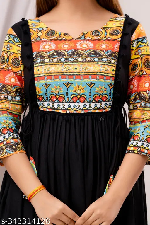 Black, embroidered, sleeveless dress with lace trim and V-neck