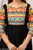 Black, embroidered, sleeveless dress with lace trim and V-neck