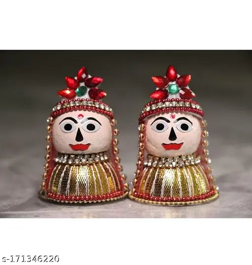 Wooden Riddhi Siddhi Ganpati's wife idol for home temple decoration, Navaratri Diwali festival. Made of supari (betel nut) material. Dimensions: 0.5" L x 0.5" W x 0.5" H. Set includes 2 pieces. Indian origin