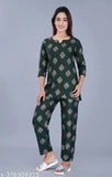 Women's printed rayon nightsuit in three-quarter sleeves, ideal for comfortable lounging at home. Soft fabric with intricate pattern, India origin