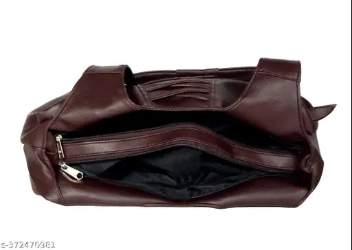 Brown leather handbag with multiple compartments and a long shoulder strap