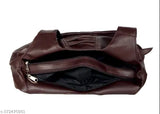 Brown leather handbag with multiple compartments and a long shoulder strap