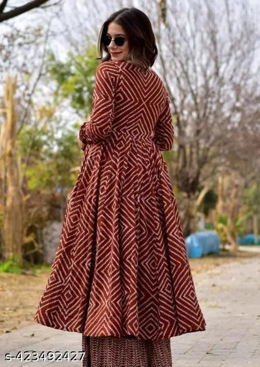 Maroon rayon Anarkali gown with pant set, featuring three-quarter sleeves and printed net pattern, on a mannequin