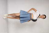Light blue denim mini skirt with side pockets and a belt. Suitable for women's fashion
