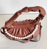 Coral satin slingbag with adjustable shoulder strap and non-removable handle