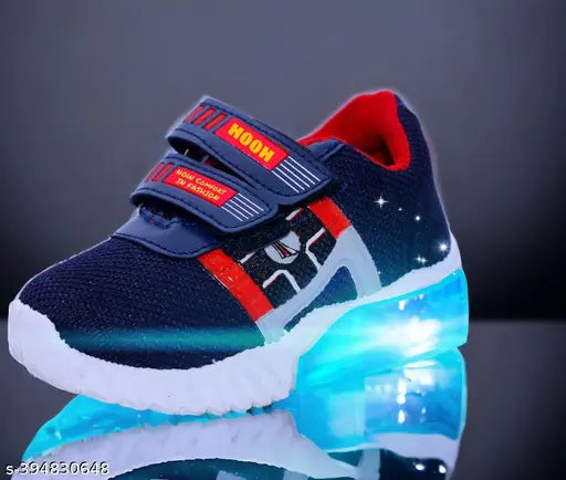 High-quality blue & red canvas shoes with LED light for kids up to 7 years (unisex). Breathable cotton blend, adjustable hook & loop closure, ideal for night outings. Made in India