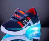 High-quality blue & red canvas shoes with LED light for kids up to 7 years (unisex). Breathable cotton blend, adjustable hook & loop closure, ideal for night outings. Made in India