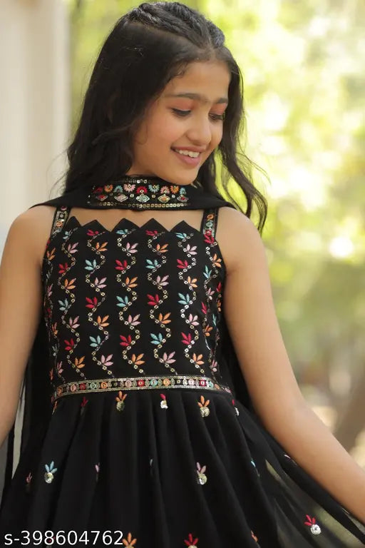 Black embroidered Georgette sharara set with matching dupatta, ideal for girls aged 3-15 years. Stunning black sharara with flared silhouette, paired with intricate embroidery on the dupatta